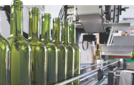 NTN-Markets-Overview glass bottles on a conveyor line ready to be filled